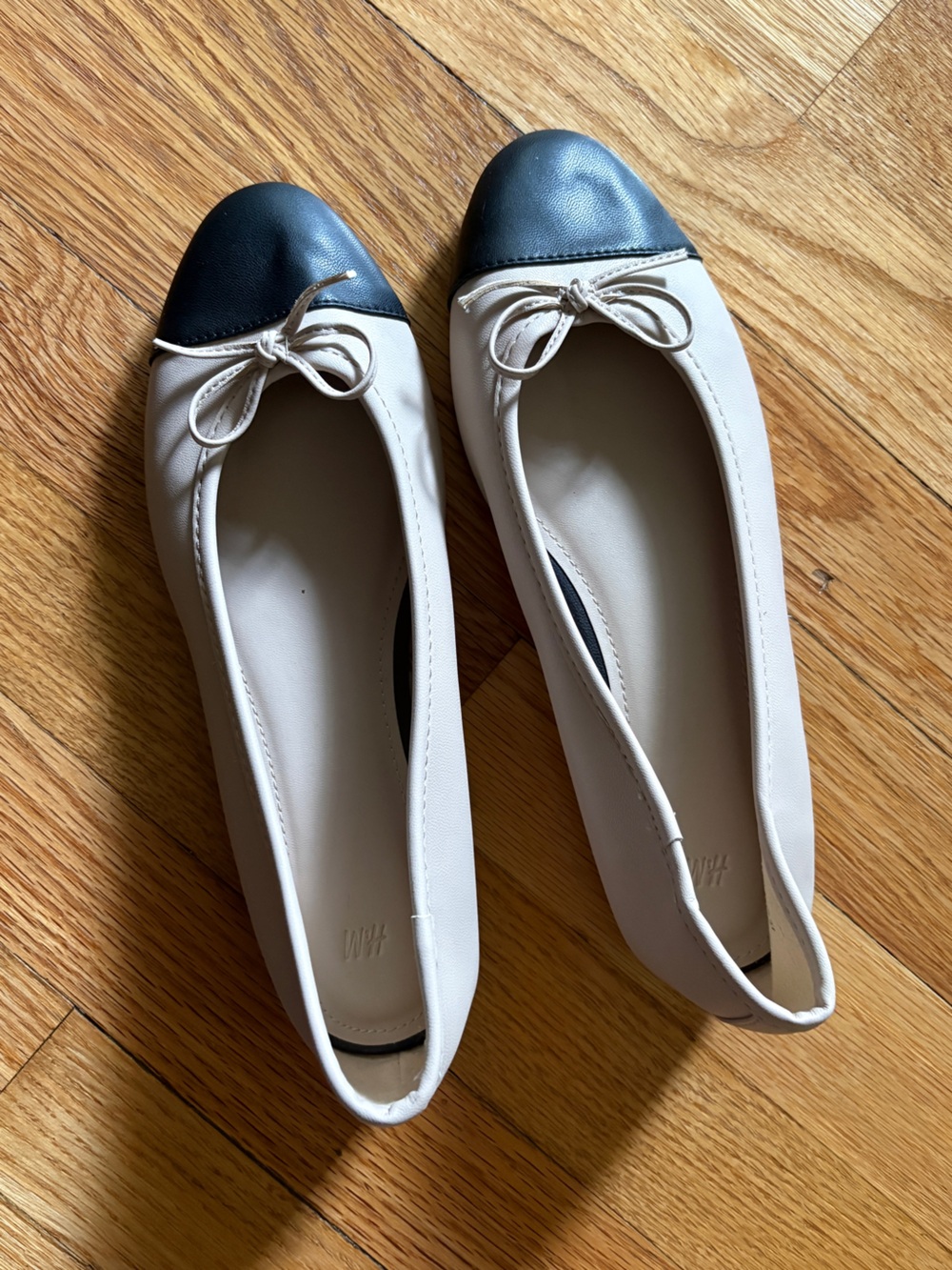 Cap-Toe Ballet Flats in Cream and Black